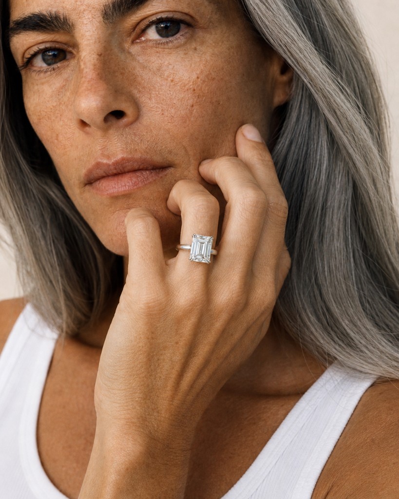 Baguette diamond ring worn at the chin